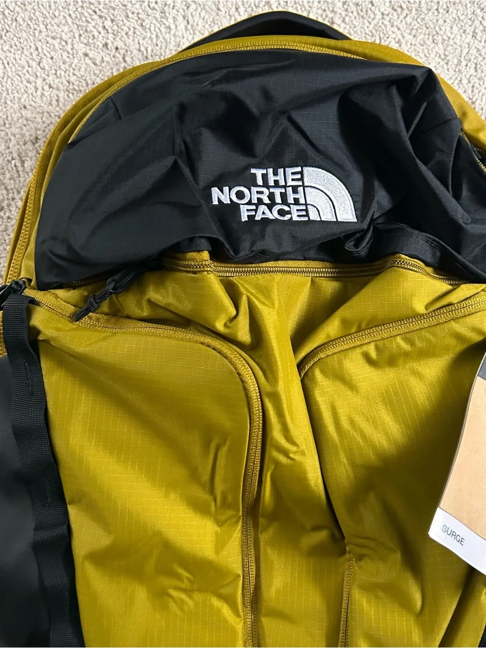 The North Face TNF Surge Unisex Backpack Deep Dijon Black NWT